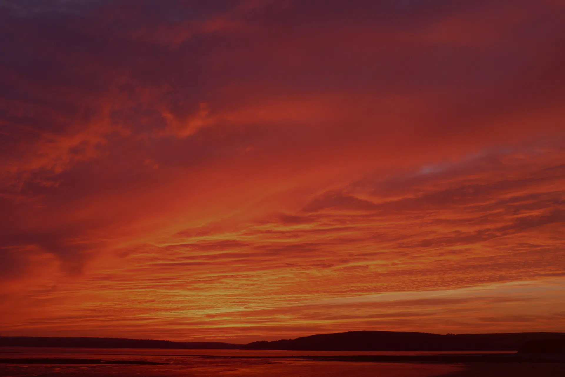 sunset of the sky and clouds over the ocean